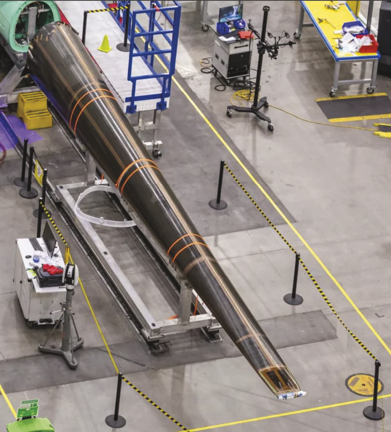 X-59 composite aircraft being manufactured on factory floor. Collier Aerospace's HyperX was used to optimize the complicated composite cone of the X-59, which is used to quiet the sound of sonic booms. Aerospace Analysis.