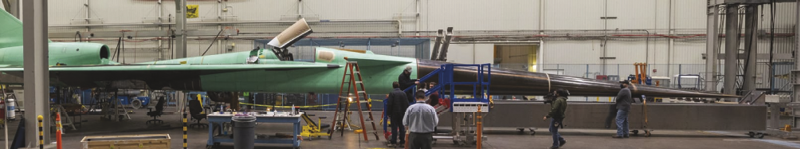 X-59 composite aircraft being manufactured on factory floor. Collier Aerospace's HyperX was used to optimize the complicated composite cone of the X-59, which is used to quiet the sound of sonic booms. Aerospace Analysis.
